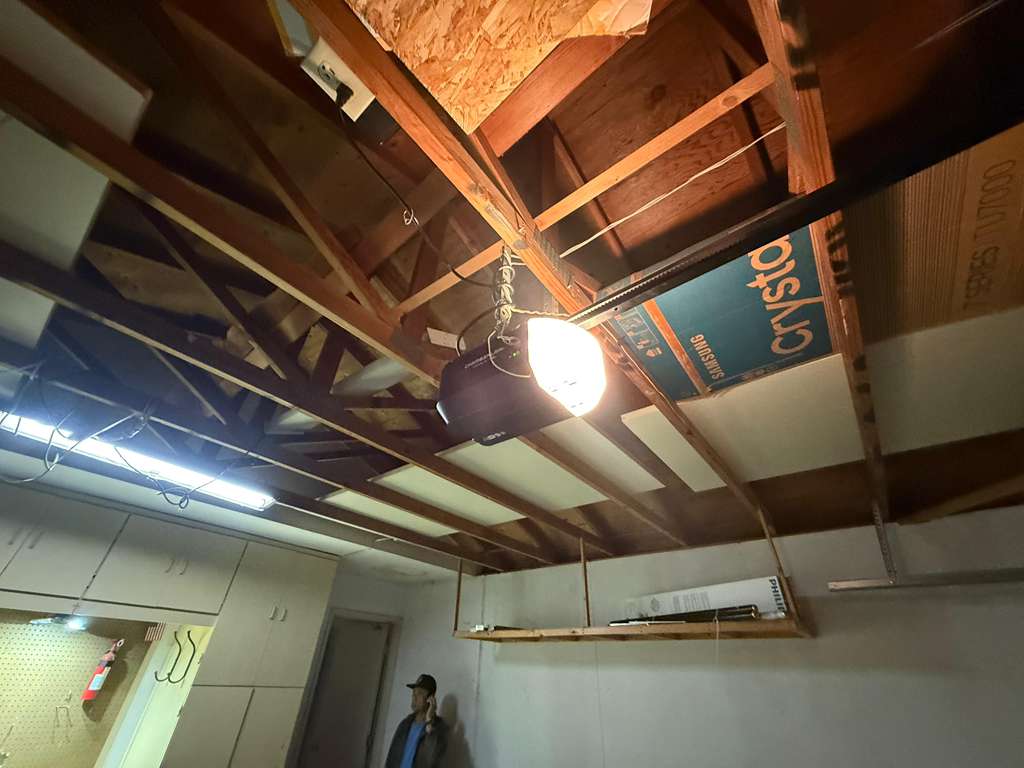 Ceiling-mounted garage door opener motor