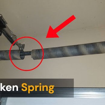 garage door torsion spring replacement service by professional technician